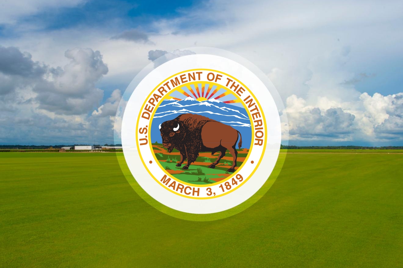 logo for U.S. Department of the Interior on farm landscape background