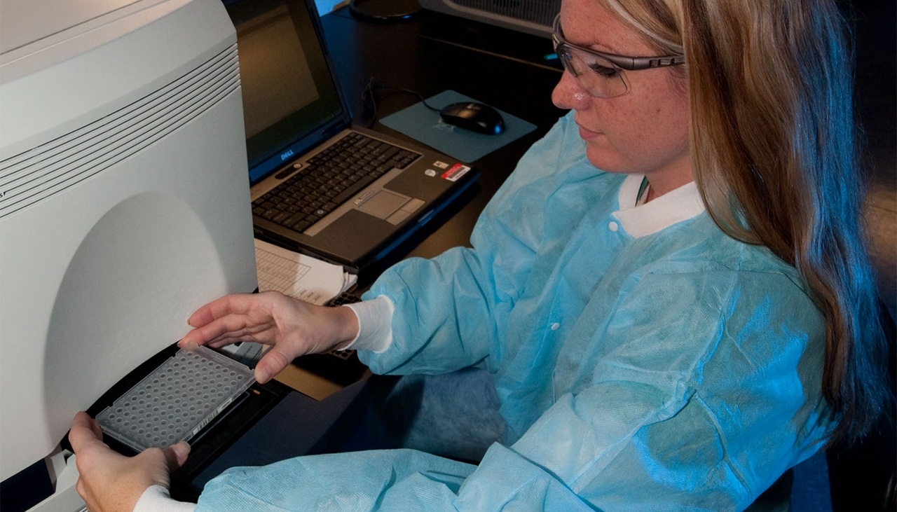 APHIS employee working in a lab
