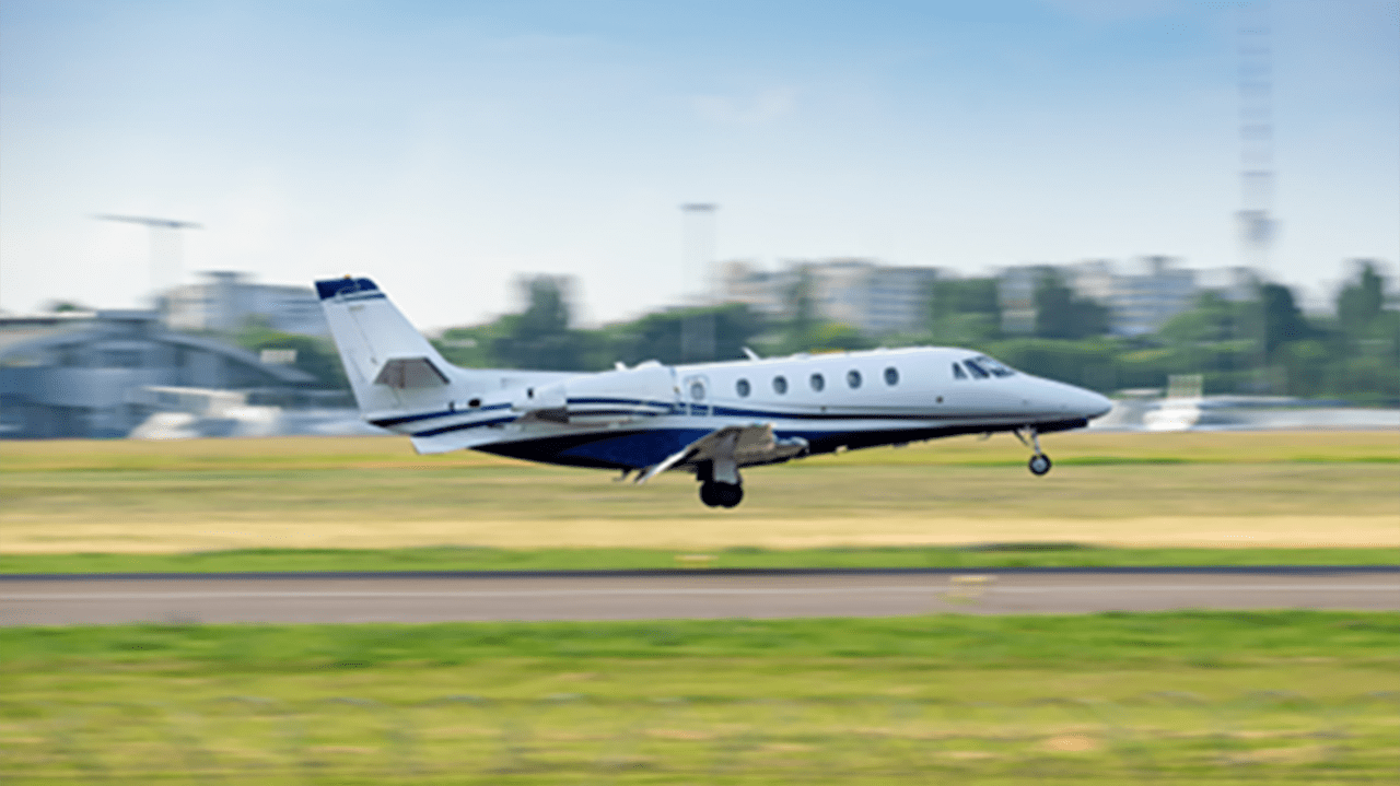 photo of a small airplane on a runway