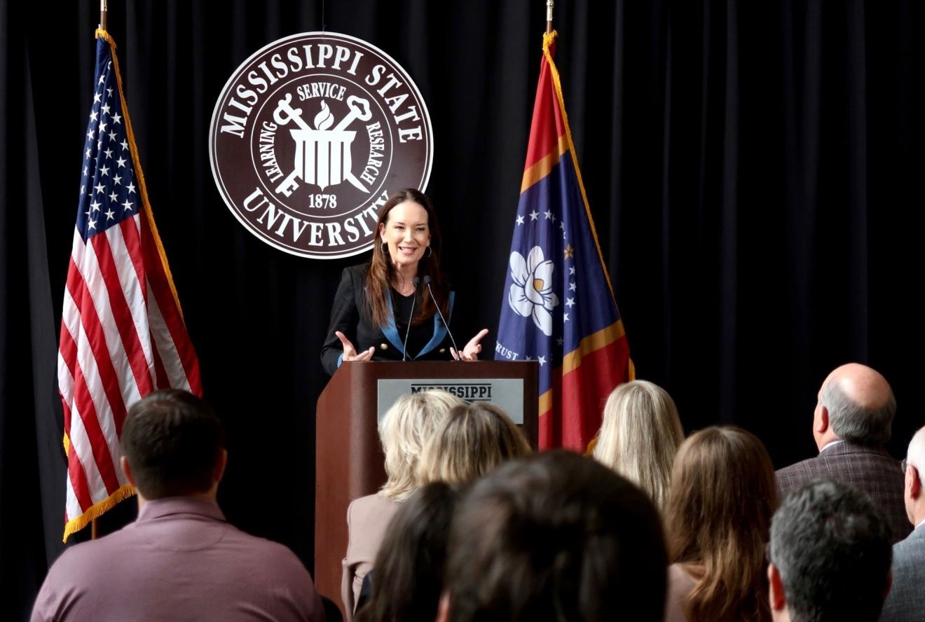 person speaking at a podium