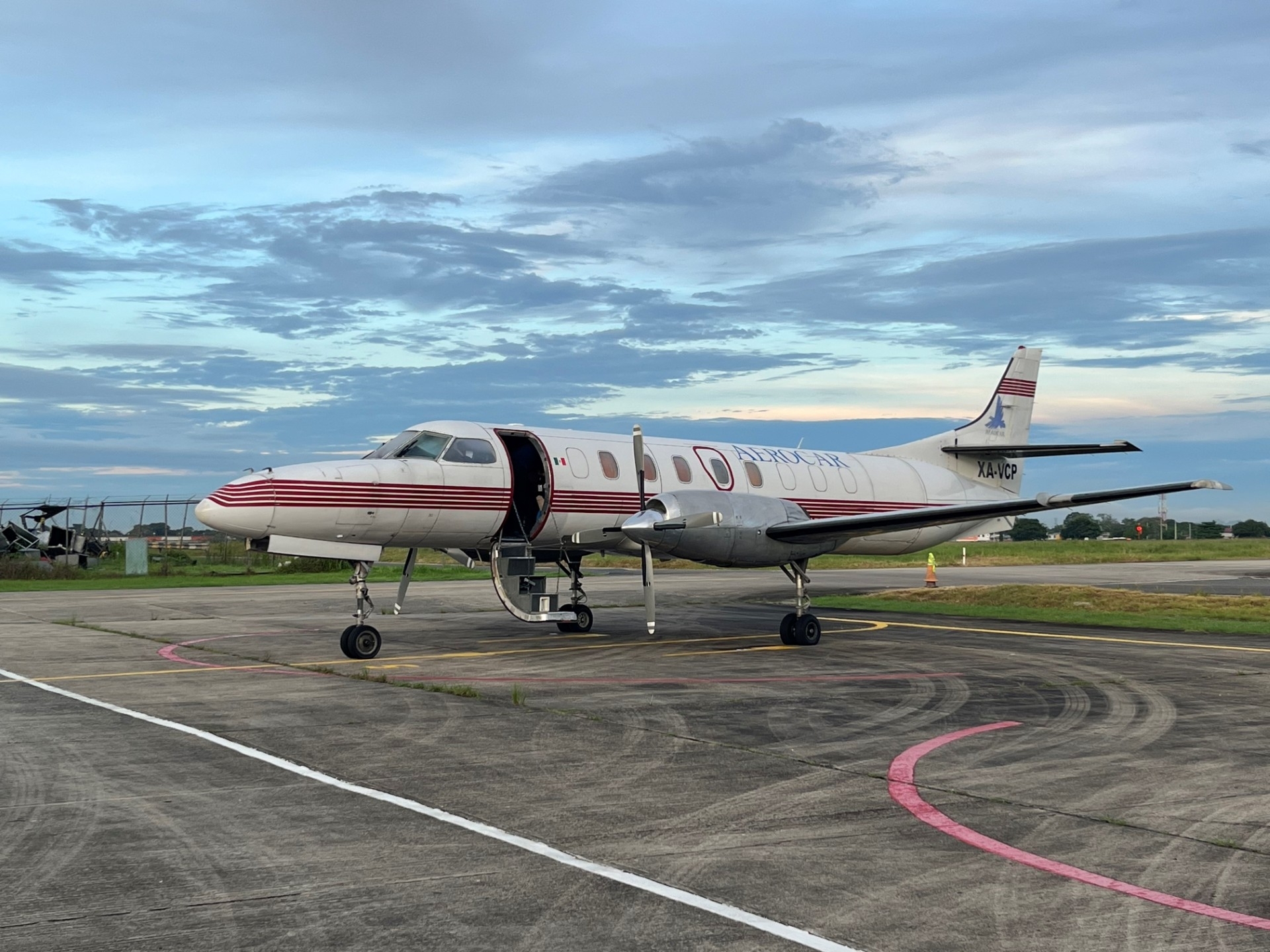 plane parked on runway at an airport