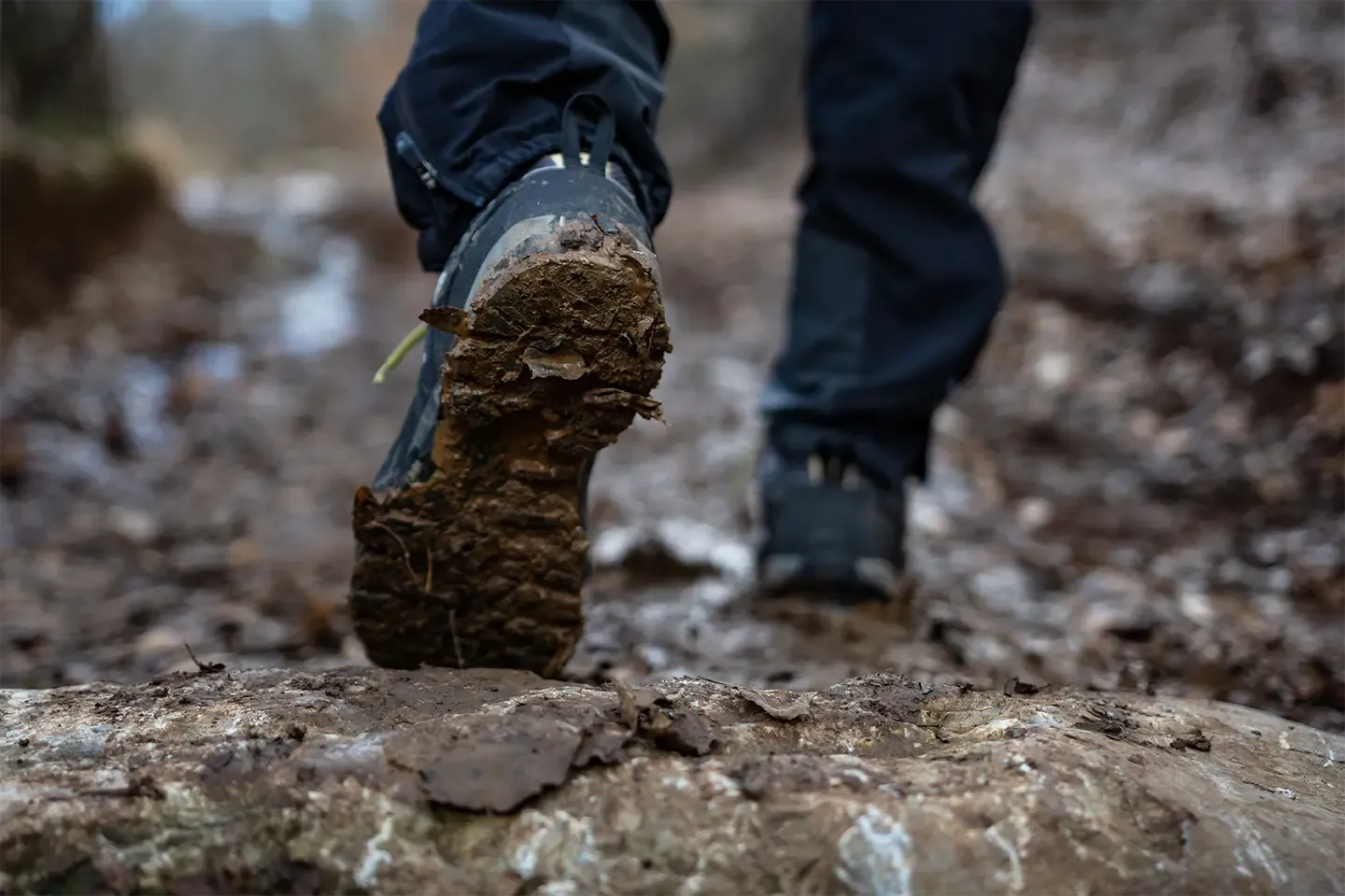 Close‑up of the sole of a muddy boot