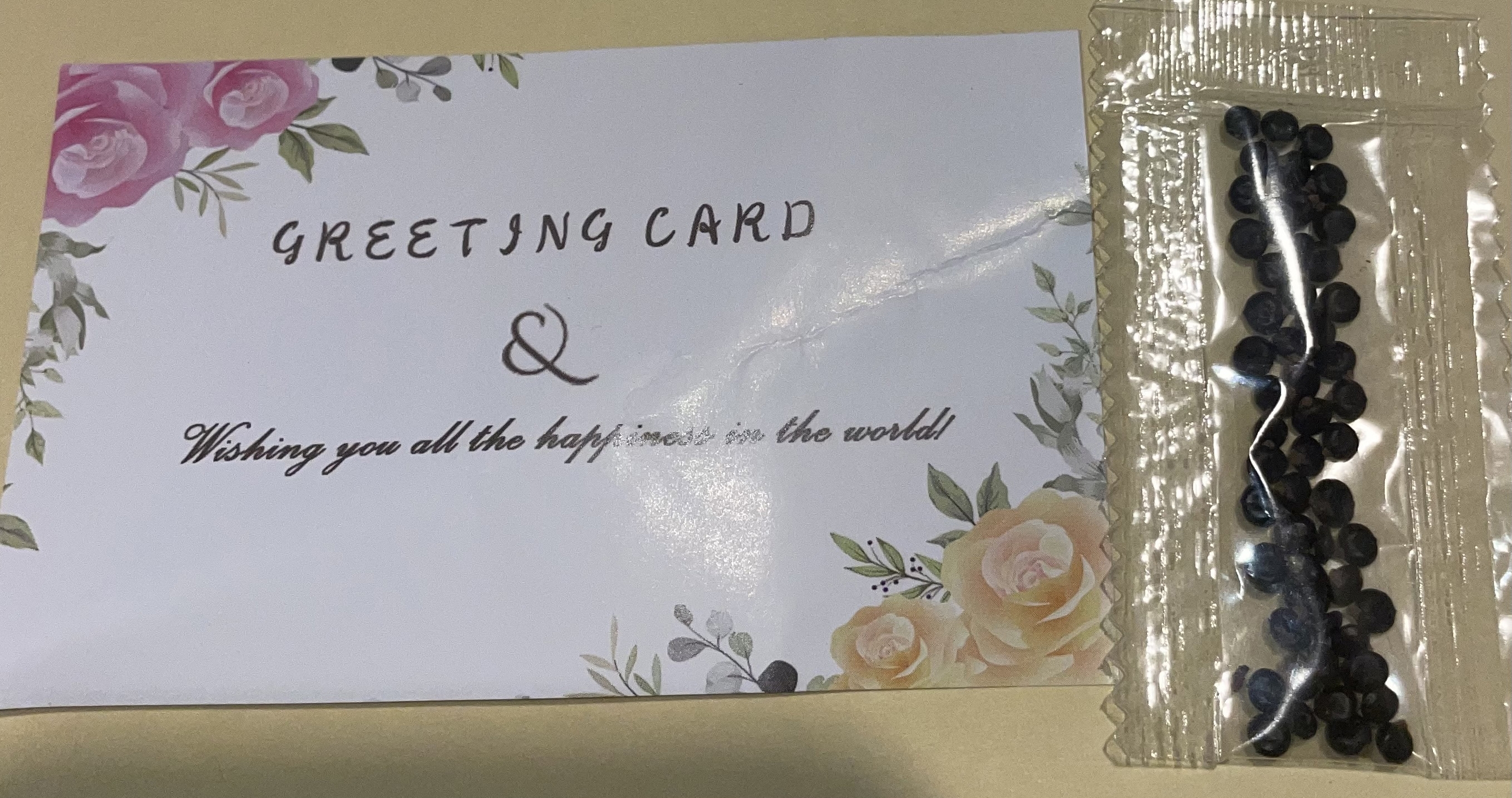 packet of seeds next to a greeting card