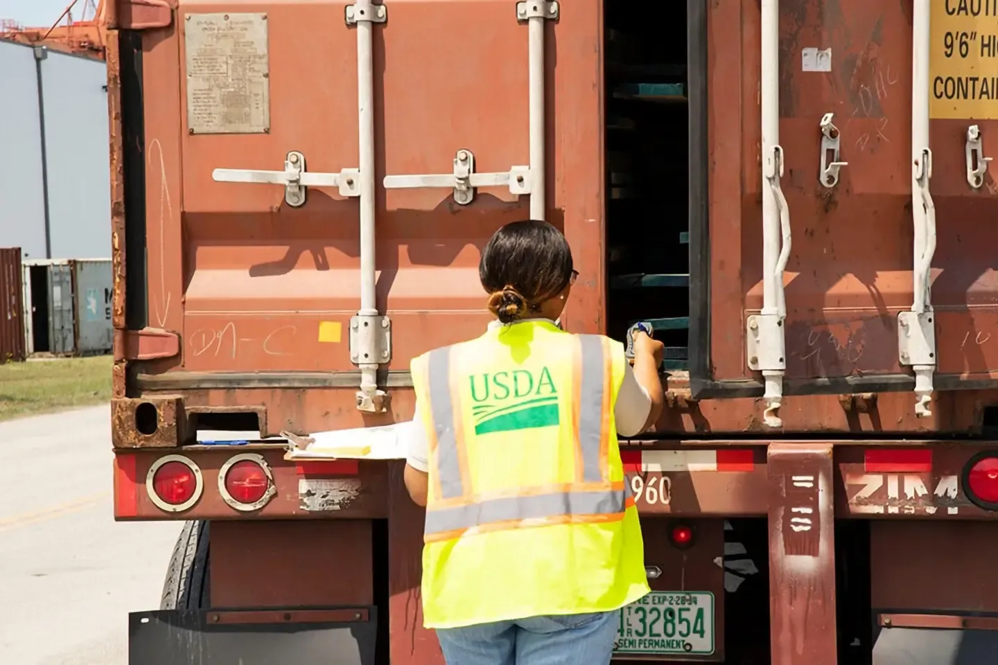USDA personnel inspecting a cargo container