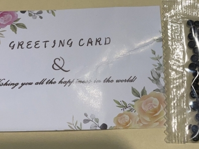 packet of seeds next to a greeting card